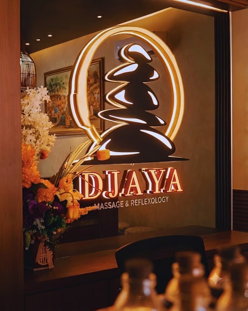 Djaya Massage & Reflexology Batam — premium massage and reflexology spa interior with illuminated brand logo in Penuin Centre