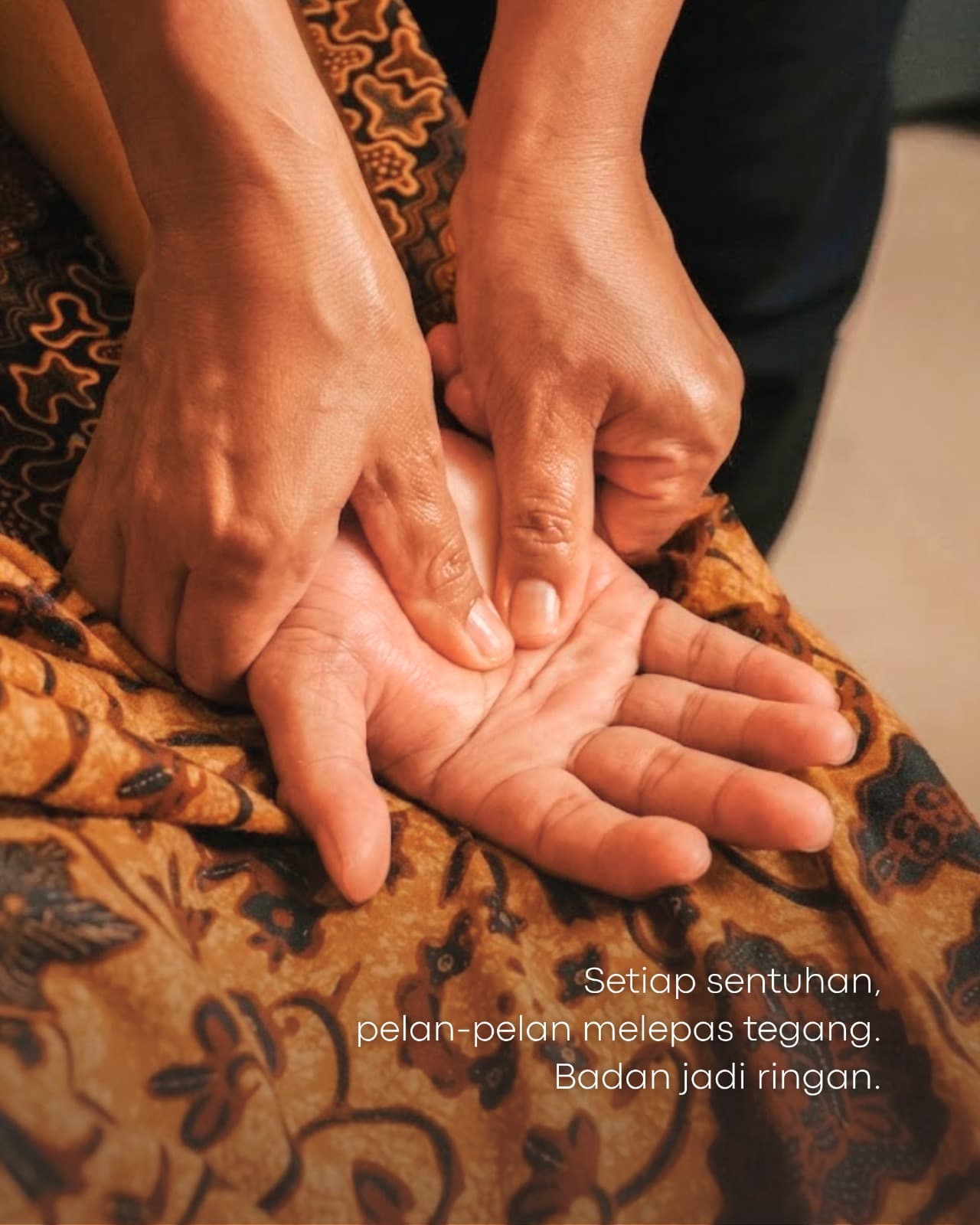 Professional foot reflexology session with traditional batik linens at Djaya Massage & Reflexology Batam
